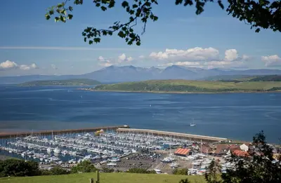 a bunch of boats docked in a harbor at Largs stay With Private parking in Largs
