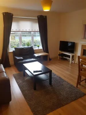 a living room with a couch and a coffee table at Livingston Business and Contractor Apartment in Livingston