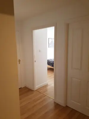an empty room with a door leading to a bedroom at Livingston Business and Contractor Apartment in Livingston