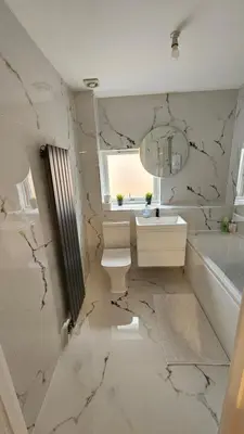 a bathroom with a sink and a toilet and a tub at Silverburn new house with free parking and nice garden in Glasgow