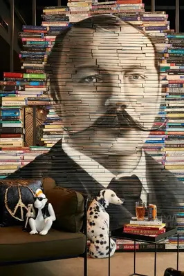 a wall with a painting of a man and a dog at Moxy Edinburgh Airport in Ingliston