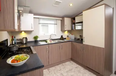 a kitchen with a bowl of fruit on a counter at Loch View in Taynuilt