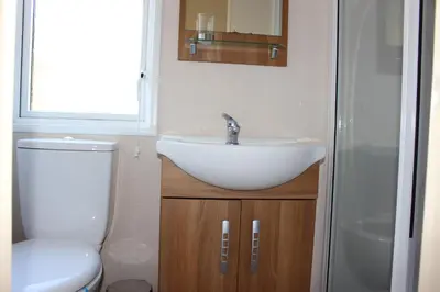 a bathroom with a sink and a toilet at Loch View in Taynuilt