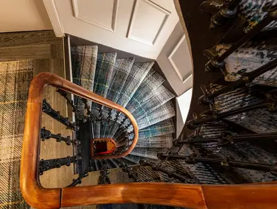 a view of a spiral staircase in a building at The Whisky Vaults in Oban