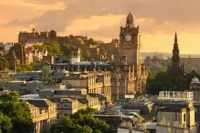 a view of a city with a clock tower at JOIVY Warm & Welcoming Flat near Edinburgh Castle in Edinburgh