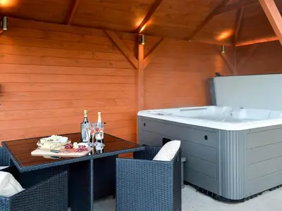 a room with a table and a bath tub at Hillview in Beith