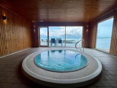 a jacuzzi tub in a room with a view at Beach Houses with Hot Tubs in Glencoe