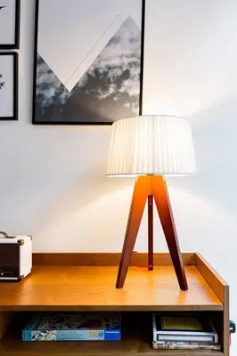 a lamp sitting on top of a wooden table at Incredible contemporary flat in heart of west end in Glasgow