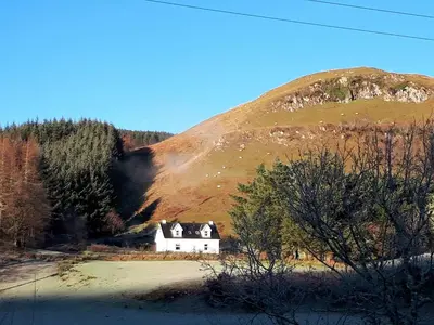 a house in the middle of a mountain at Achalic Beag in Lerags