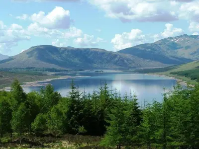 a view of a lake with mountains in the background at The Loch Lomond Arms Hotel in Luss