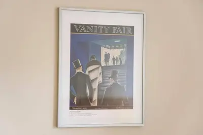 a framed picture of a vantyre fair on a wall at JOIVY Amazing Location! Lovely Rose St Apt in New Town in Edinburgh