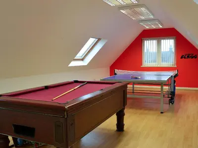 a room with a pool table and a ping pong table at Hawthorn Cottage in Stranraer