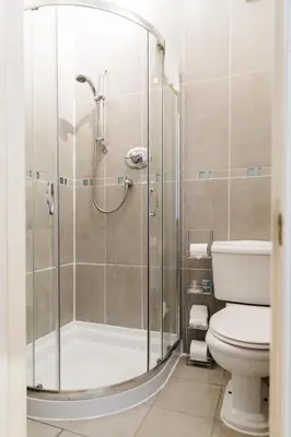a bathroom with a shower and a toilet at Altavona House in Oban