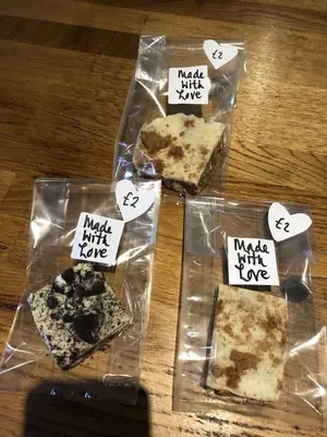 three pieces of pizza in plastic bags on a table at The Drymen Inn in Drymen