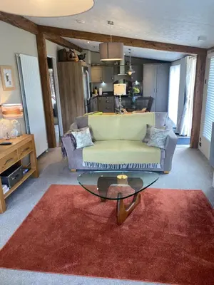 a living room with a couch and a table at Brightwater Lodge in Dunning