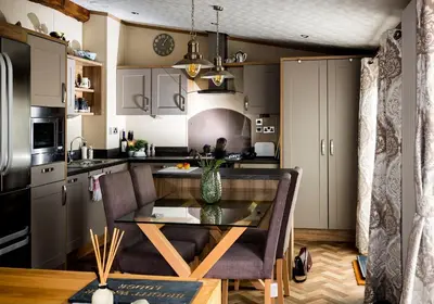 a kitchen with a table with a vase on it at Brightwater Lodge in Dunning