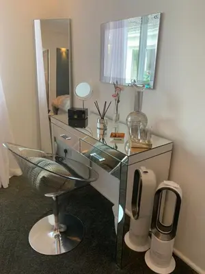 a desk with a mirror and a chair in a room at Invercreran Lodge Luxury Bed & Breakfast in Appin