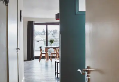 a room with a table and a dining room at The Ranald Apartments in Oban