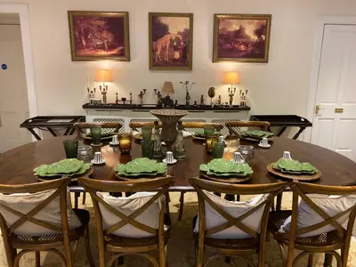 a dining room with a table with chairs and a tableablish at The West Highland Way Hotel and Retreat Accommodation in Glasgow