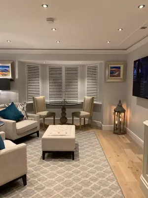 a living room with a couch and chairs and a table at Bagpipers Luxury Hideaway Glencoe Ballachulish Highlands Near Fort William in Glencoe