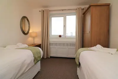 a hotel room with two beds and a window at Signature - Gordon House in Glasgow