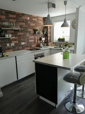 a kitchen with white cabinets and a white counter top at Boutique Coastal appt nr Edinburgh in Saint Davids