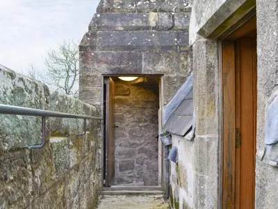 an entrance to a stone building with a door at Braidwood Castle - Uk10672 in Braidwood