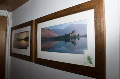two framed photographs on a wall in a room at Whitecroft B&B in Edinburgh