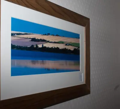 a framed picture of a lake on a wall at Whitecroft B&B in Edinburgh