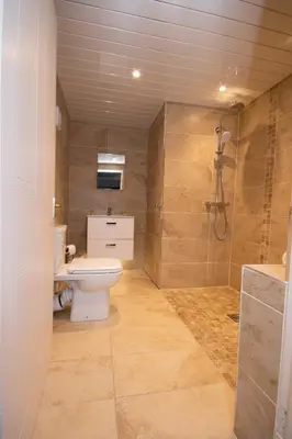 a bathroom with a toilet and a sink and a shower at The Georgian hotel in Coatbridge