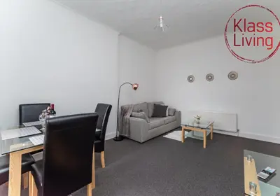 an office with a desk and a chair and a couch at Albion Apartment by Klass Living Coatbridge in Coatbridge