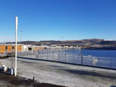 a fence in front of a body of water at 7 Royal View Apartments in Stirling