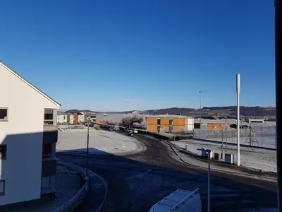 a view of a street with a building and a road at 7 Royal View Apartments in Stirling