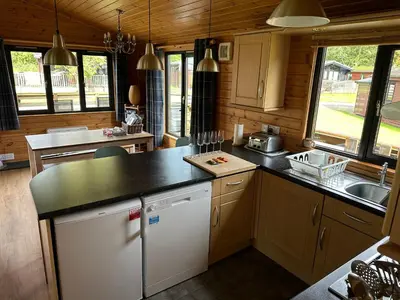 a kitchen with a sink and a counter top at Ben Lomond Lodge in Rowardennan