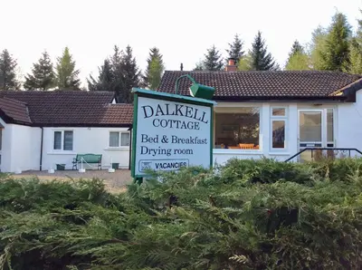 a sign for aldiki coffee in front of a building at Dalkell Cottages in Tyndrum