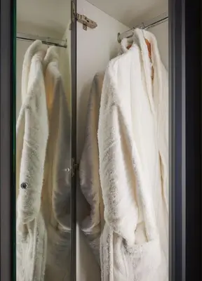 a bathroom with white towels hanging on a rack at Luxury Hideaways in Keilour