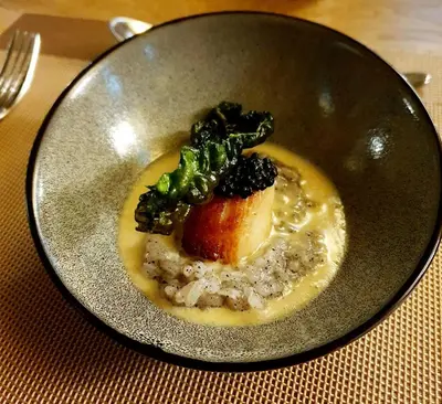 a plate of food with broccoli on a table at Achray House Restaurant with Rooms in Saint Fillans