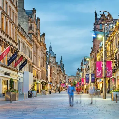 a city street with people walking down the street at Beautiful 2 Bed Apartment Rose St in Glasgow