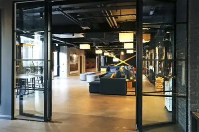 a living room with a couch and chairs in a building at JOIVY at VITA Fountainbridge - Adults only - Breakfast buffet in Edinburgh