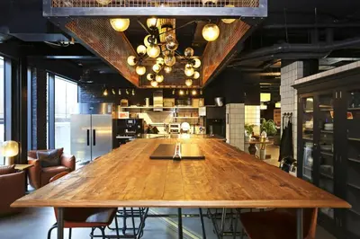 a large wooden table in the middle of a room at JOIVY at VITA Fountainbridge - Adults only - Breakfast buffet in Edinburgh