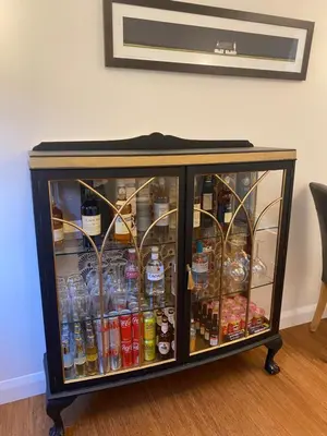 a drink cabinet filled with lots of soda bottles at Aspen Lodge in Oban