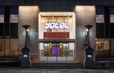 a jelle store with a purple door at night at YOTEL Edinburgh in Edinburgh
