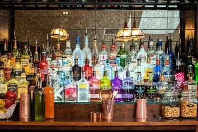 a bar filled with lots of bottles of alcohol at Livingston Lodge Hotel in Livingston
