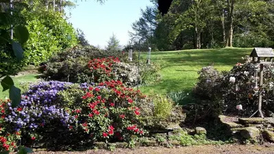 a garden with colorful flowers in a yard at North Lodge of Orchil in Braco