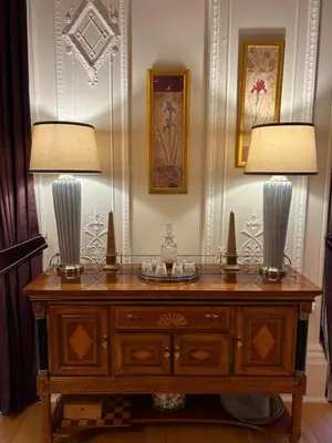 two lamps on top of a wooden dresser at Grand in the Park in Glasgow
