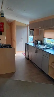 a kitchen with a sink and a counter top at Fairways 21...Turnberry in Girvan