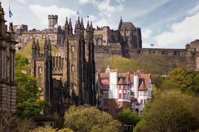 a castle with a bunch of buildings in front of it at Amazing penthouse, stunning views, Castle 2 mins in Edinburgh
