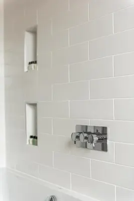 a bathroom sink with a faucet and two mirrors at Amazing penthouse, stunning views, Castle 2 mins in Edinburgh