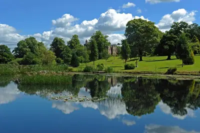 a view of a lake in front of a building at No 1 Ramageton at Carnell Estates in Hurlford