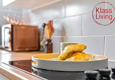 a plate of croissants on a stove in a kitchen at Anderson Apartment by Klass Living Motherwell in Motherwell